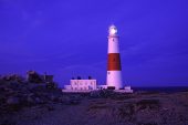 Portland Bill lighthouse at dusk Dorset England UK