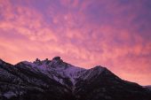 Sunset lit clouds over Pic du Clocher Alps France