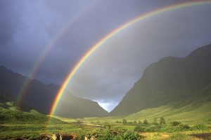 Double rainbow and Glen Coe with surrounding mountains Highland Region Scotland