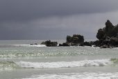 Storm beyond a rocky outcrop Pebble Island Falkland Islands British Overseas Territory December 2016