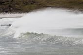 Waves crashing on to shore Pebble Island Falkland Islands British Overseas Territory December 2016
