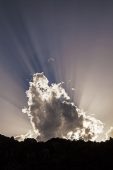 Light rays and clouds over mountains Sardinia Italy