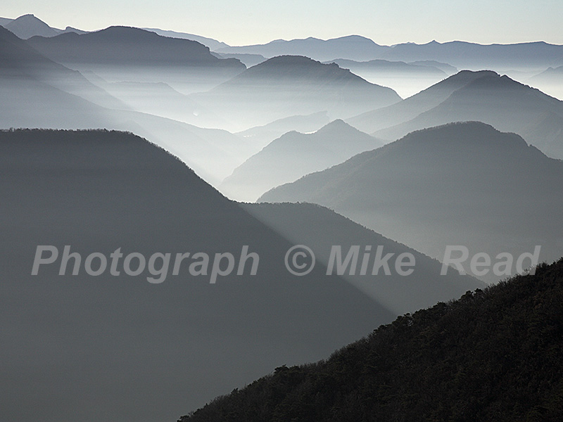 Mountains in mist at sunrise near the Col de Rousset Parc Naturel Regional du Vercors France